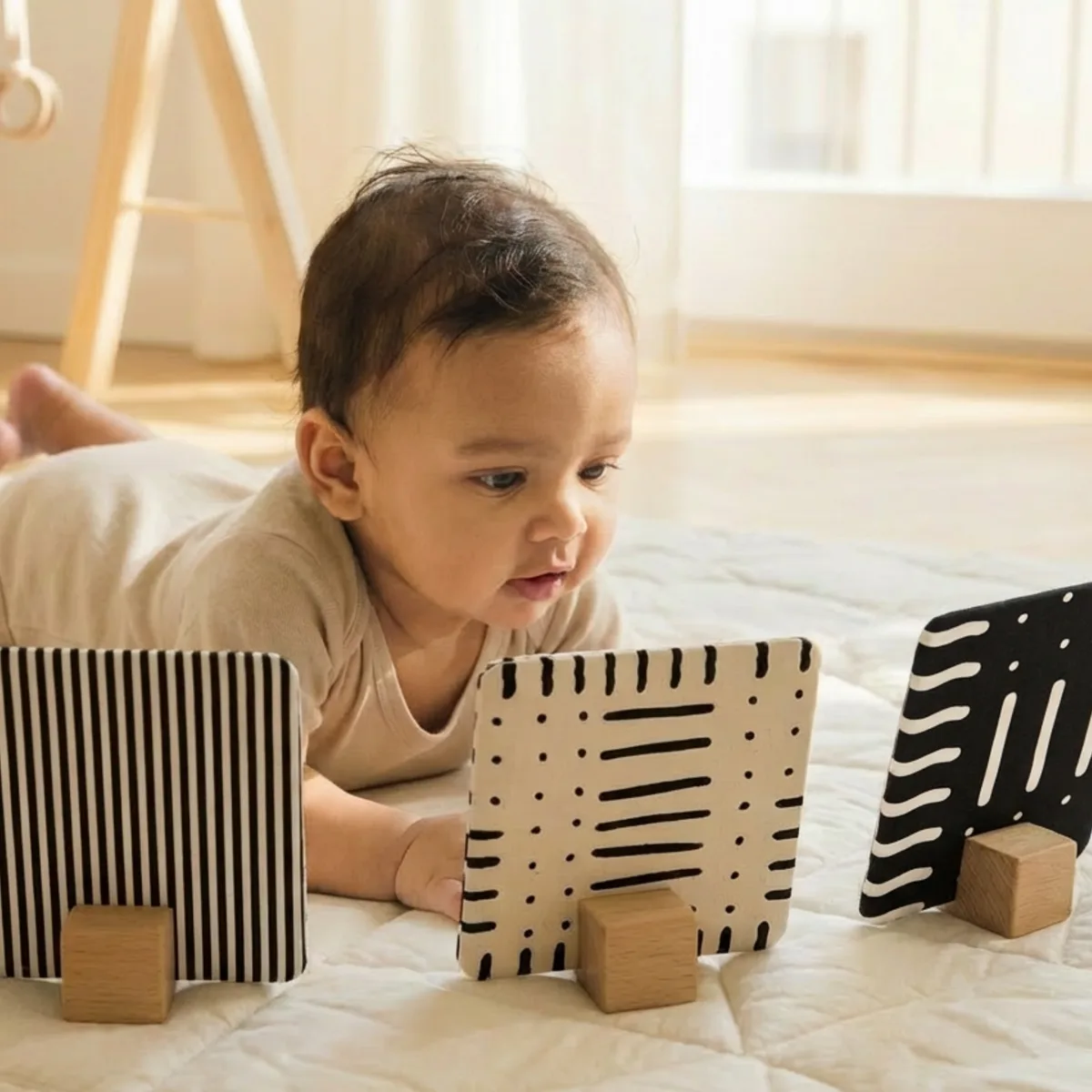 Baby playing with Drishti Kit products