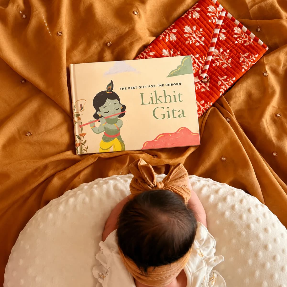 Mother writing the Bhagavad Gita during pregnancy