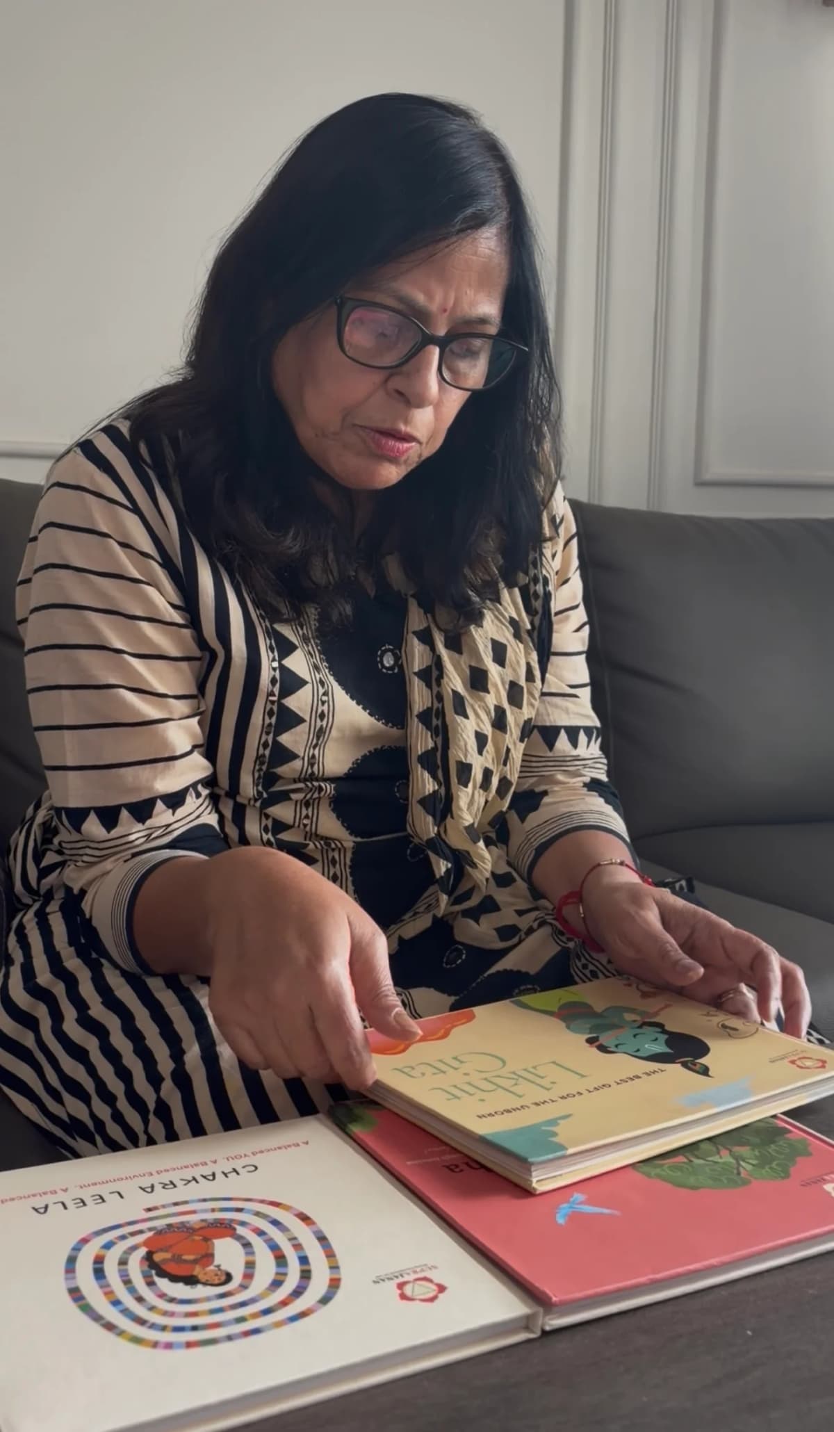 Grandmother-to-be with all three books open on the table